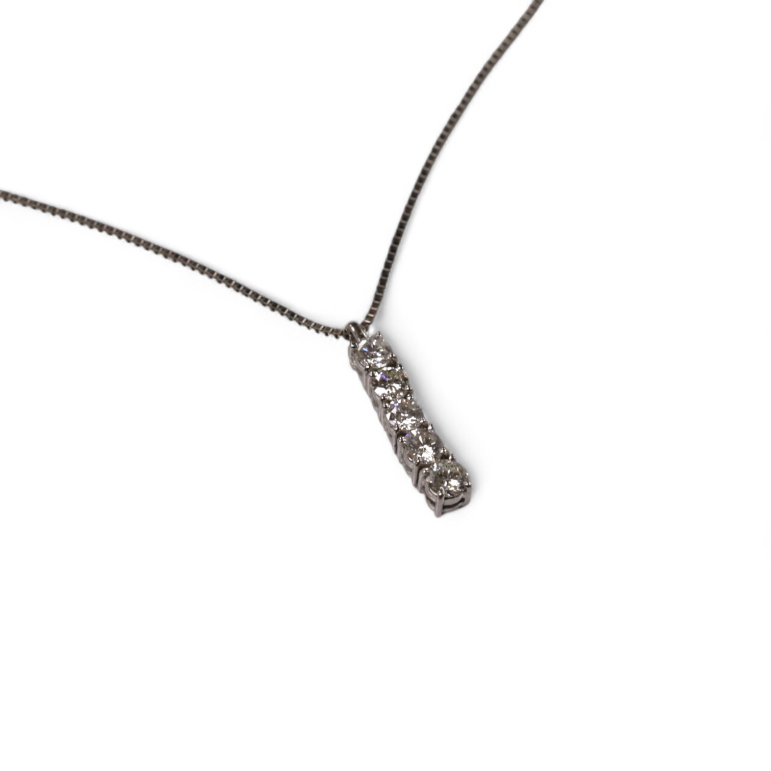 A modern white metal (stamped PT900) and five stone diamond set line pendant, on white metal (stamped pt850), overall 49cm, gross weight 4.9 grams. Condition - fair to good